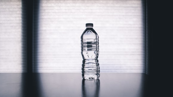 Water bottle beside exercise equipment